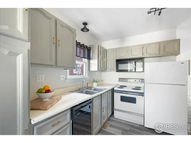 a kitchen with a sink stove and refrigerator