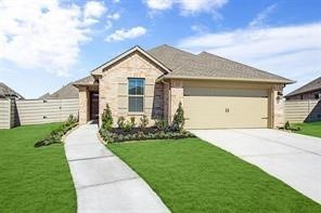 2011 Oak Leaf Court Manvel, TX 77578 - Photo 4 of 28 This is a modern single-story brick house with a two-car garage. It features a well-maintained front yard, a concrete driveway, and a walkway leading to the entrance. The exterior has a clean, welcoming appearance with neat landscaping.
