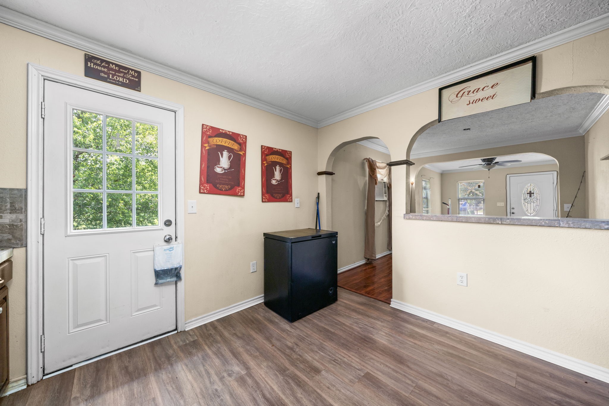 1814 Mansfield Street Houston, TX 77091 - Photo 14 of 29 a view of a kitchen with furniture and wooden floor