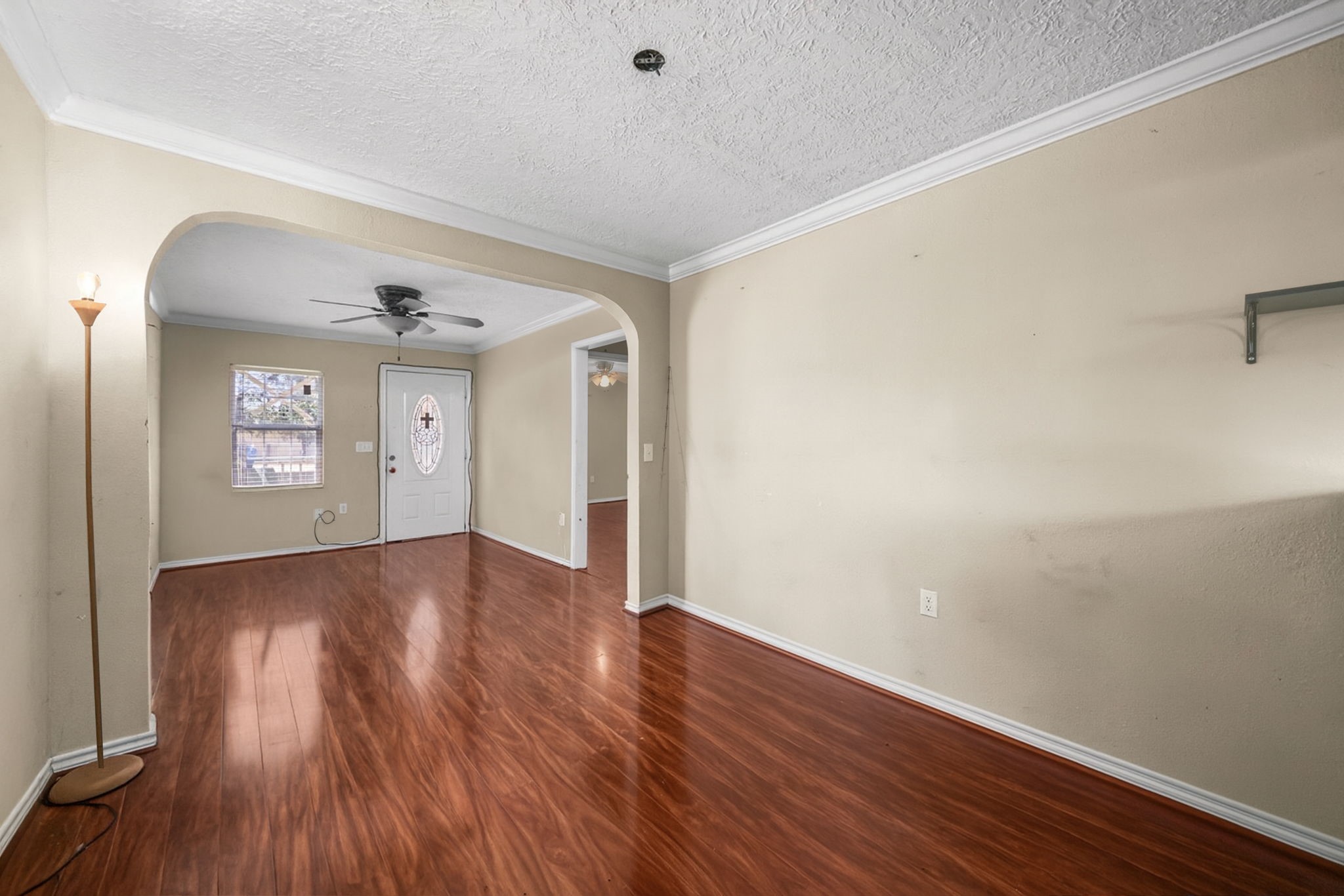 1814 Mansfield Street Houston, TX 77091 - Photo 15 of 29 a view of empty room with wooden floor and fan
