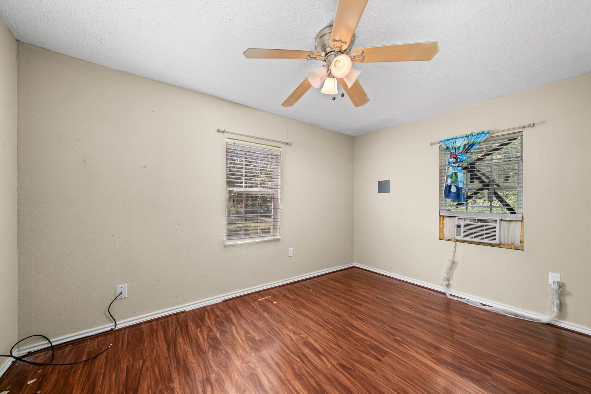 1814 Mansfield Street Houston, TX 77091 - Photo 16 of 29 wooden floor in an empty room with a window