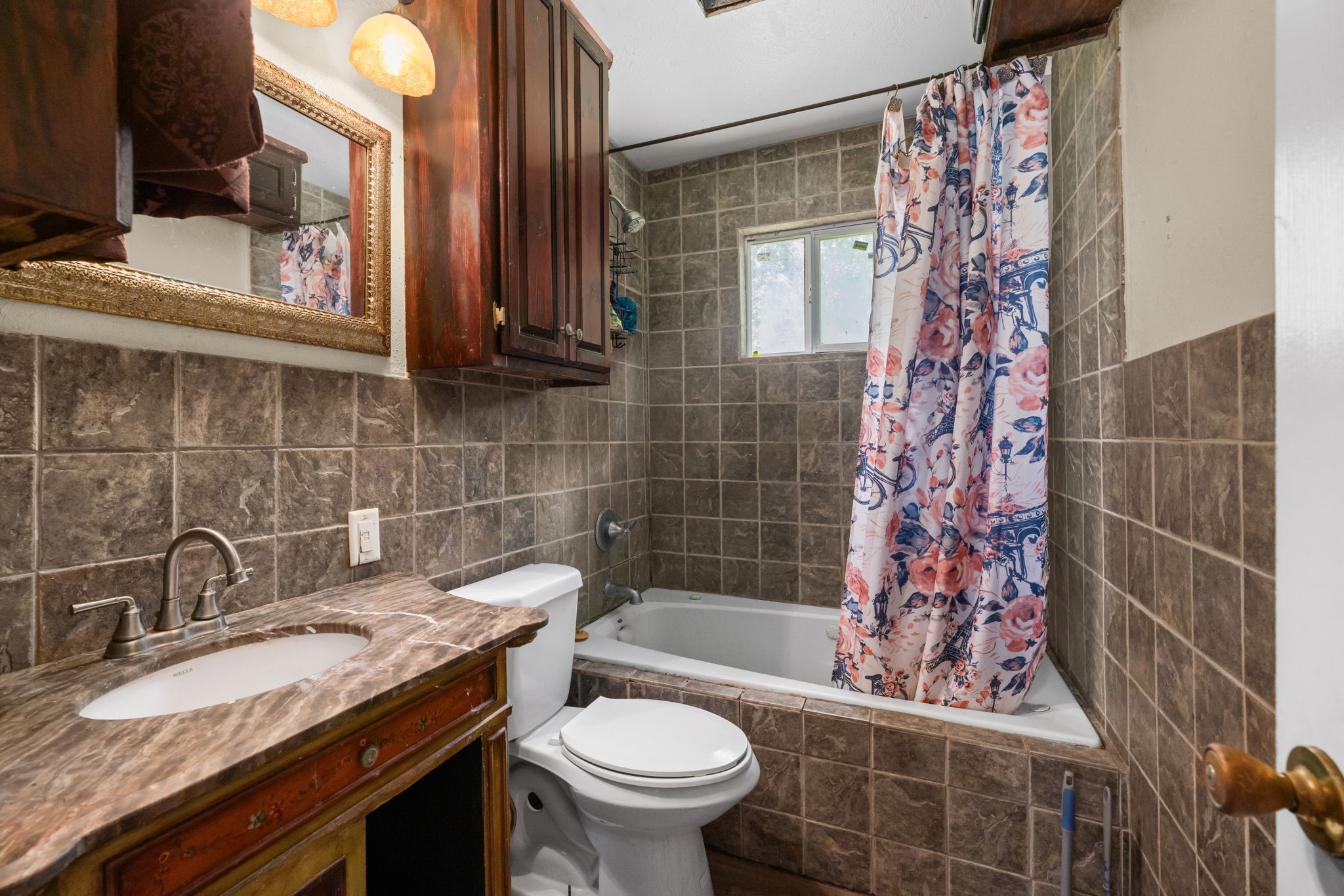 1814 Mansfield Street Houston, TX 77091 - Photo 20 of 29 a bathroom with a sink toilet and shower