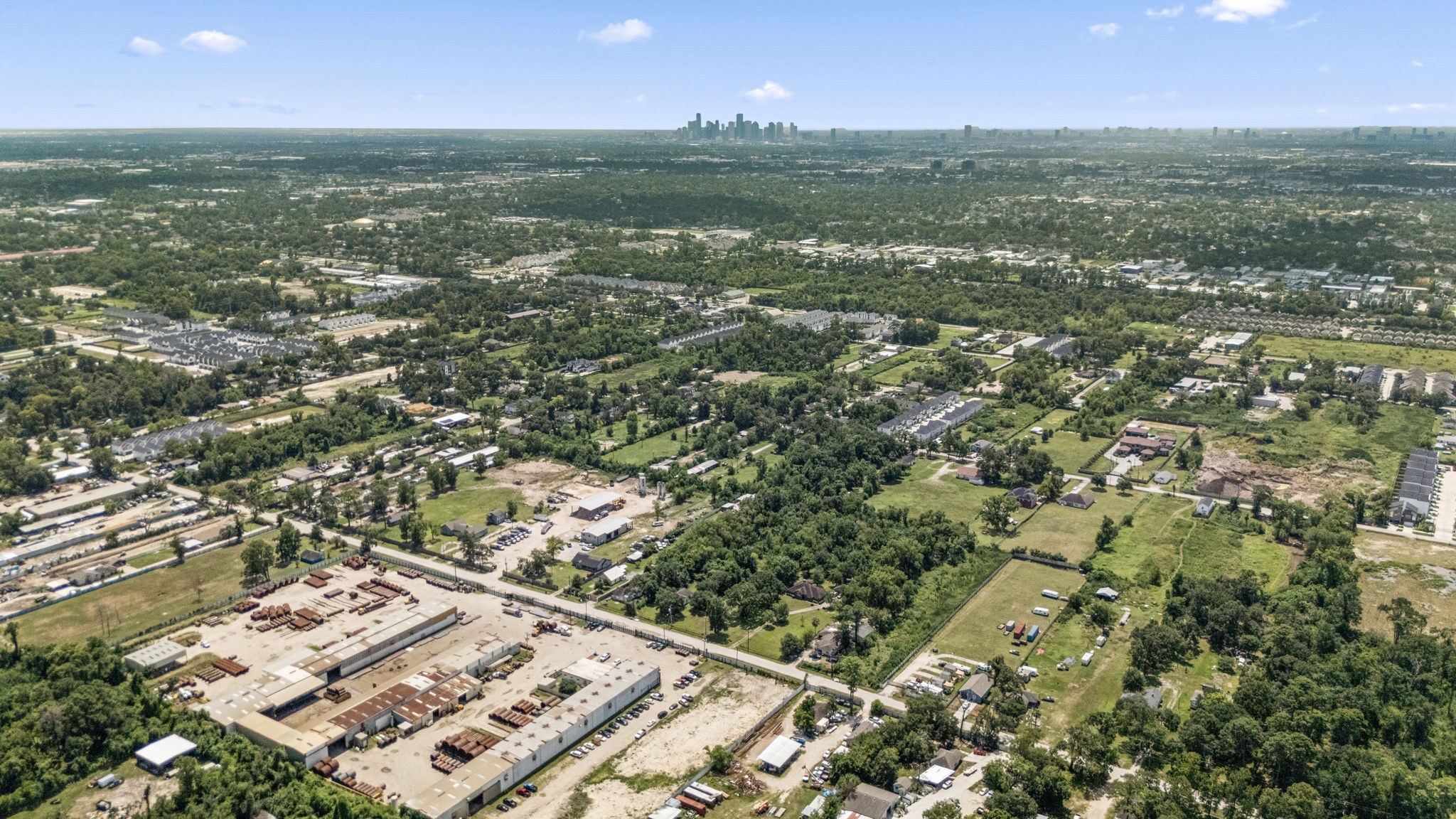 1814 Mansfield Street Houston, TX 77091 - Photo 21 of 29 an aerial view of residential houses with outdoor space and trees