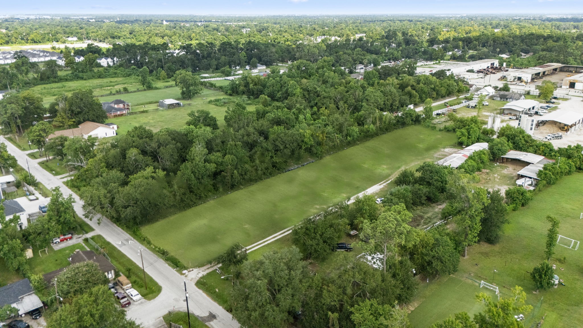 1814 Mansfield Street Houston, TX 77091 - Photo 8 of 29 a view of a green field with lots of plants in it