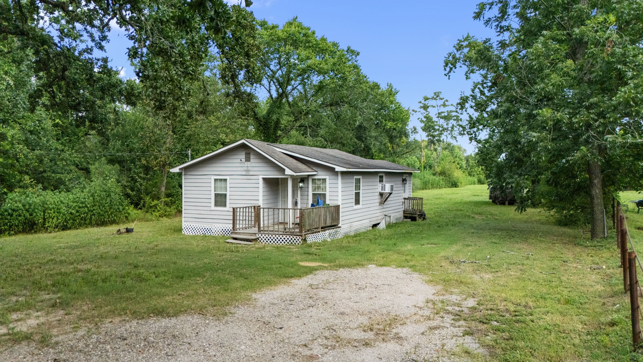 1814 Mansfield Street Houston, TX 77091 - Photo 10 of 29 a view of a house with a yard and large trees