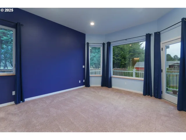 a view of an empty room with a balcony