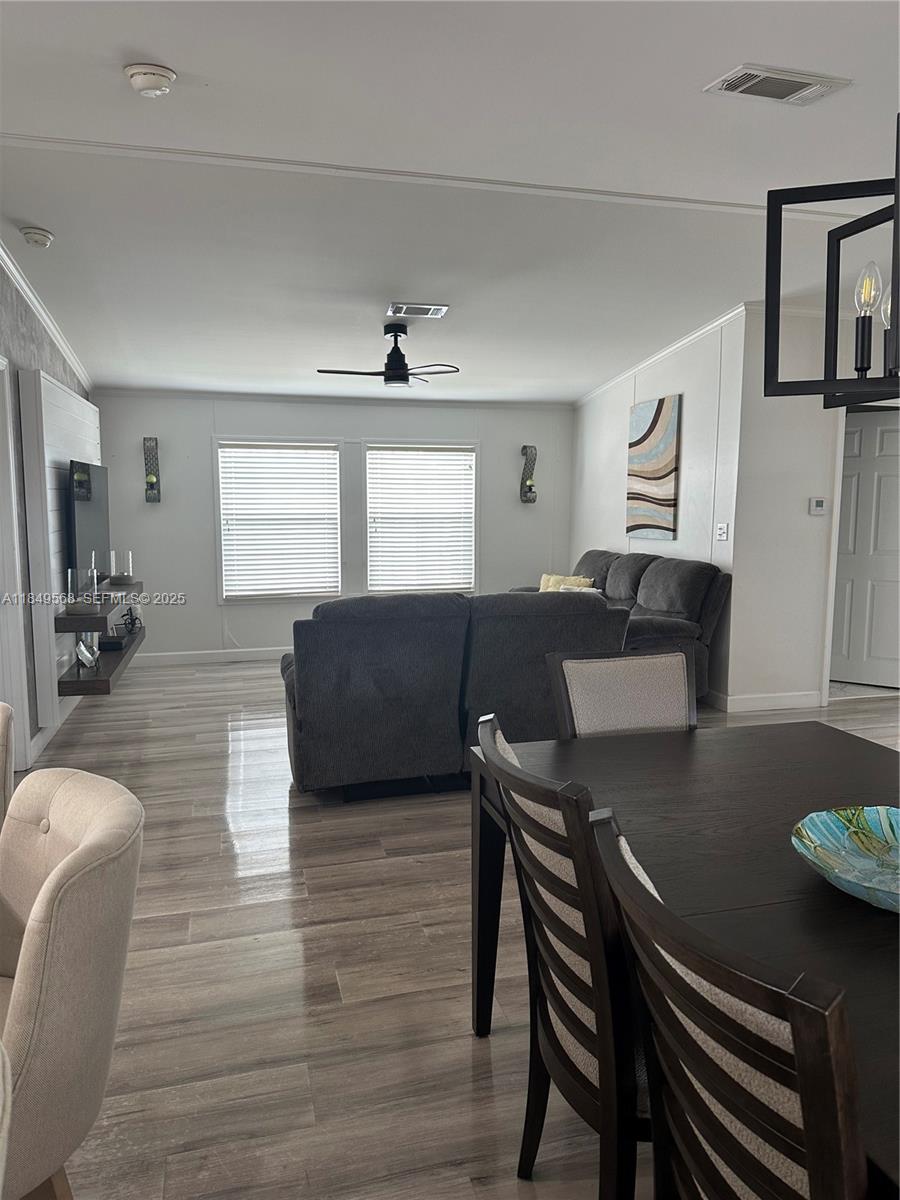 1570 Southwest 64th Way Boca Raton, FL 33428 - Photo 15 of 24 a living room with furniture and a wooden floor