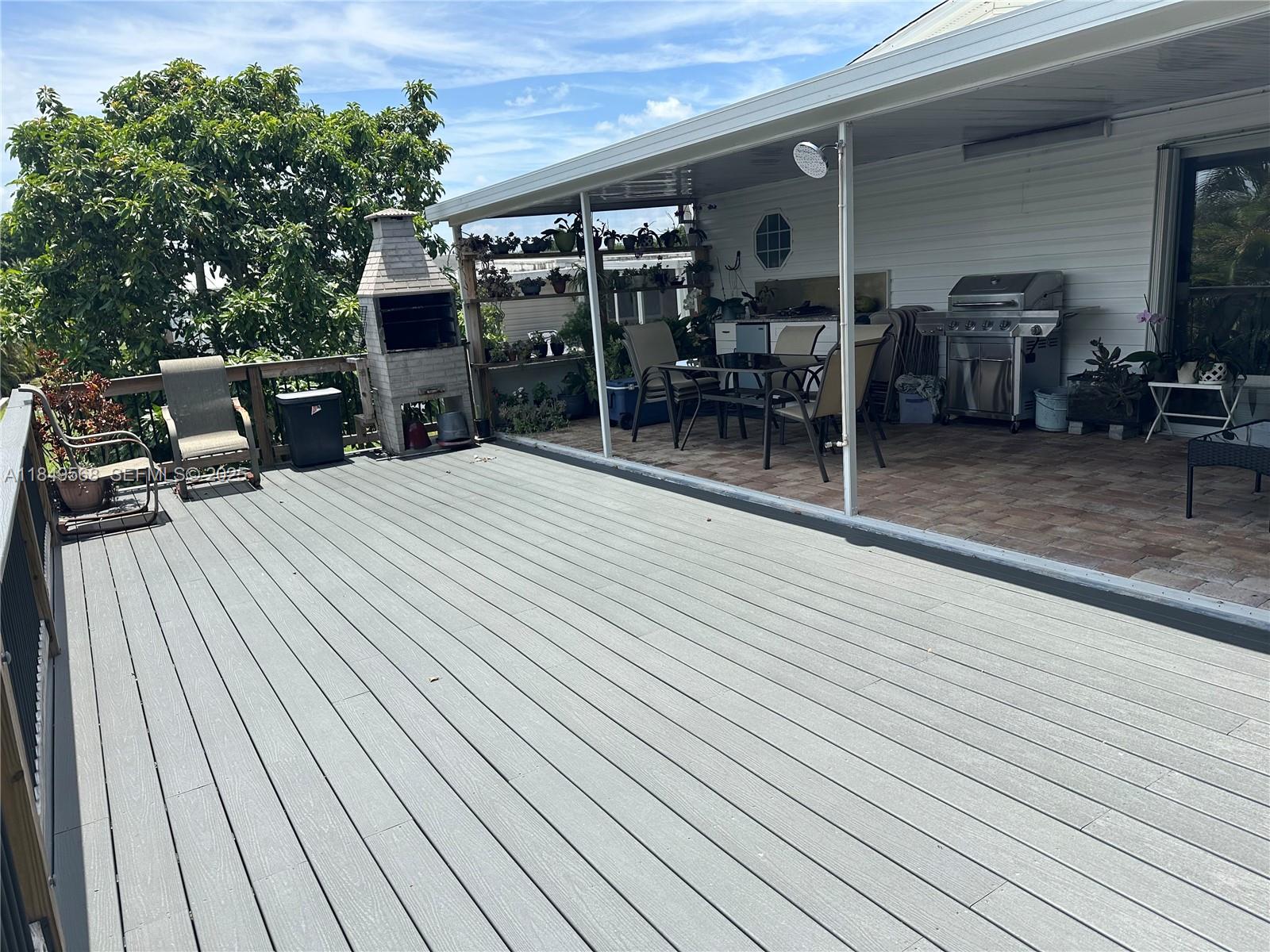 1570 Southwest 64th Way Boca Raton, FL 33428 - Photo 22 of 24 a view of a patio with table and chairs