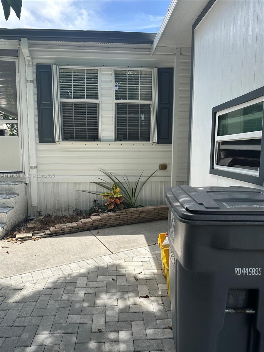 1570 Southwest 64th Way Boca Raton, FL 33428 - Photo 6 of 24 a view of a house with a yard