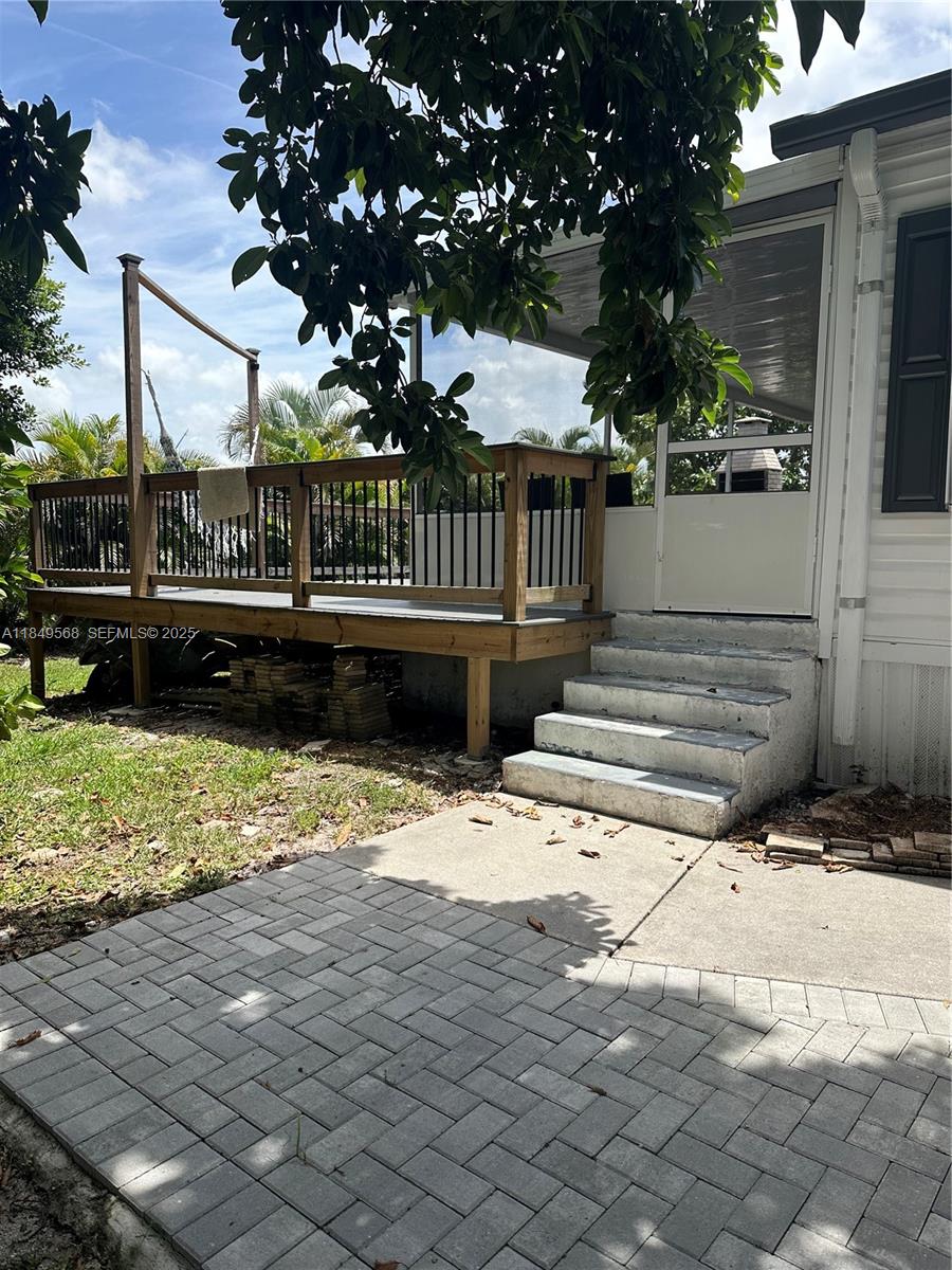 1570 Southwest 64th Way Boca Raton, FL 33428 - Photo 7 of 24 a view of a deck with a yard