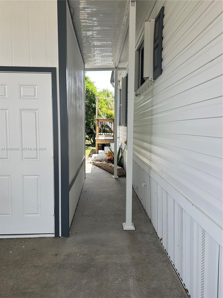 1570 Southwest 64th Way Boca Raton, FL 33428 - Photo 8 of 24 a view of hallway with patio
