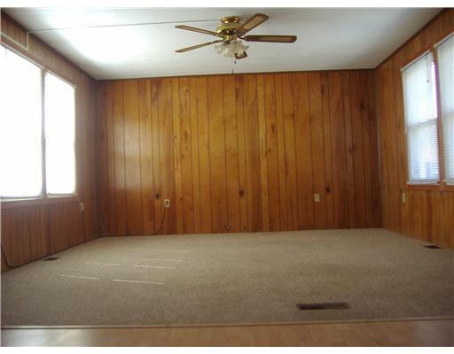 24 Airport Road Coventry, RI 02816 - Photo 5 of 9 Living Room. Offering full size windows on both sides, the living room is generous in size!