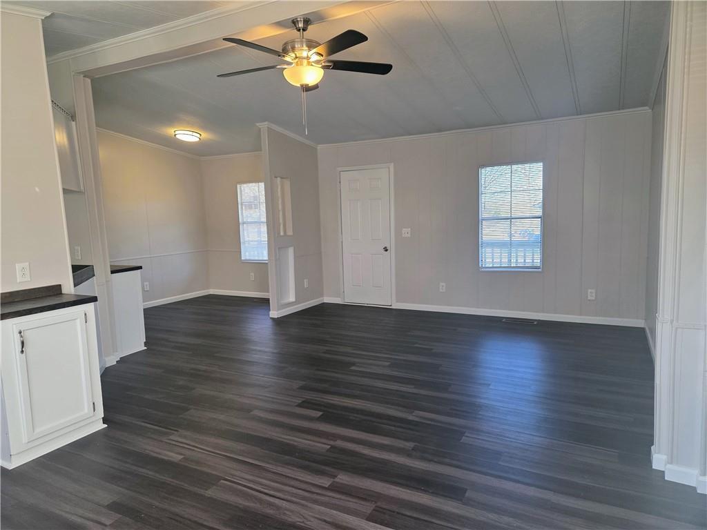 190 B Sweetwater Branch Road Fort Mitchell, AL 36856 - Photo 4 of 18 Unfurnished living room with dark wood-style floors, and a ceiling fan