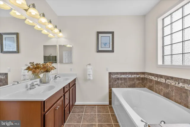 a bathroom with a sink a toilet and shower curtain