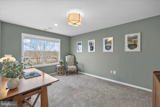 a bedroom with a bed and a lamp on table