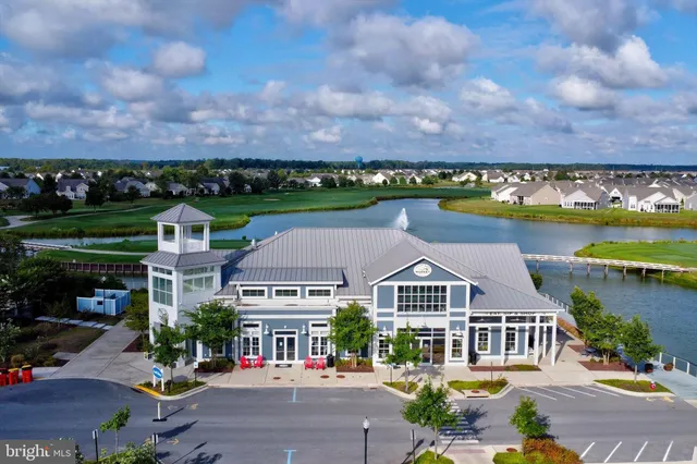 a view of a patio with dining table and chairs with wooden floor
