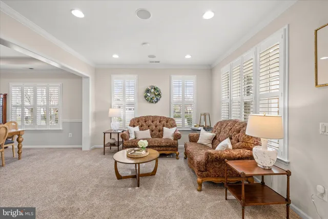 a living room with furniture and a table