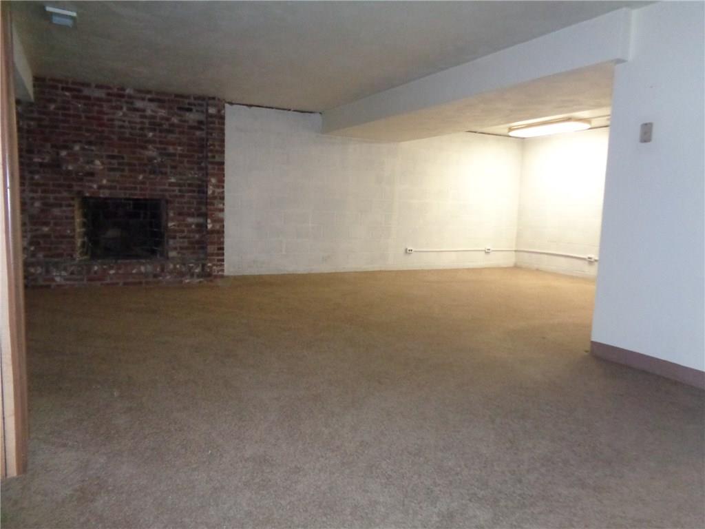 6416 Hilty Road Murrysville, PA 15632 - Photo 22 of 23 30x24 Semi Finished Game-room with Full Brick Face Fireplace and Full Bath