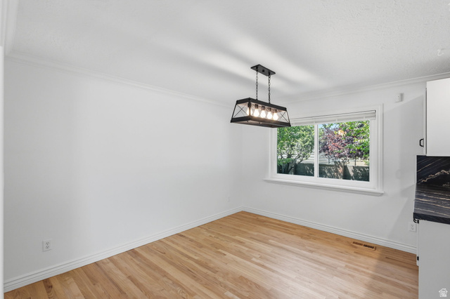 358 West 1200th Street North Mapleton, UT 84664 - Photo 11 of 30 Dining area featuring hardwood flooring, a contemporary black metal chandelier, new paint and window
