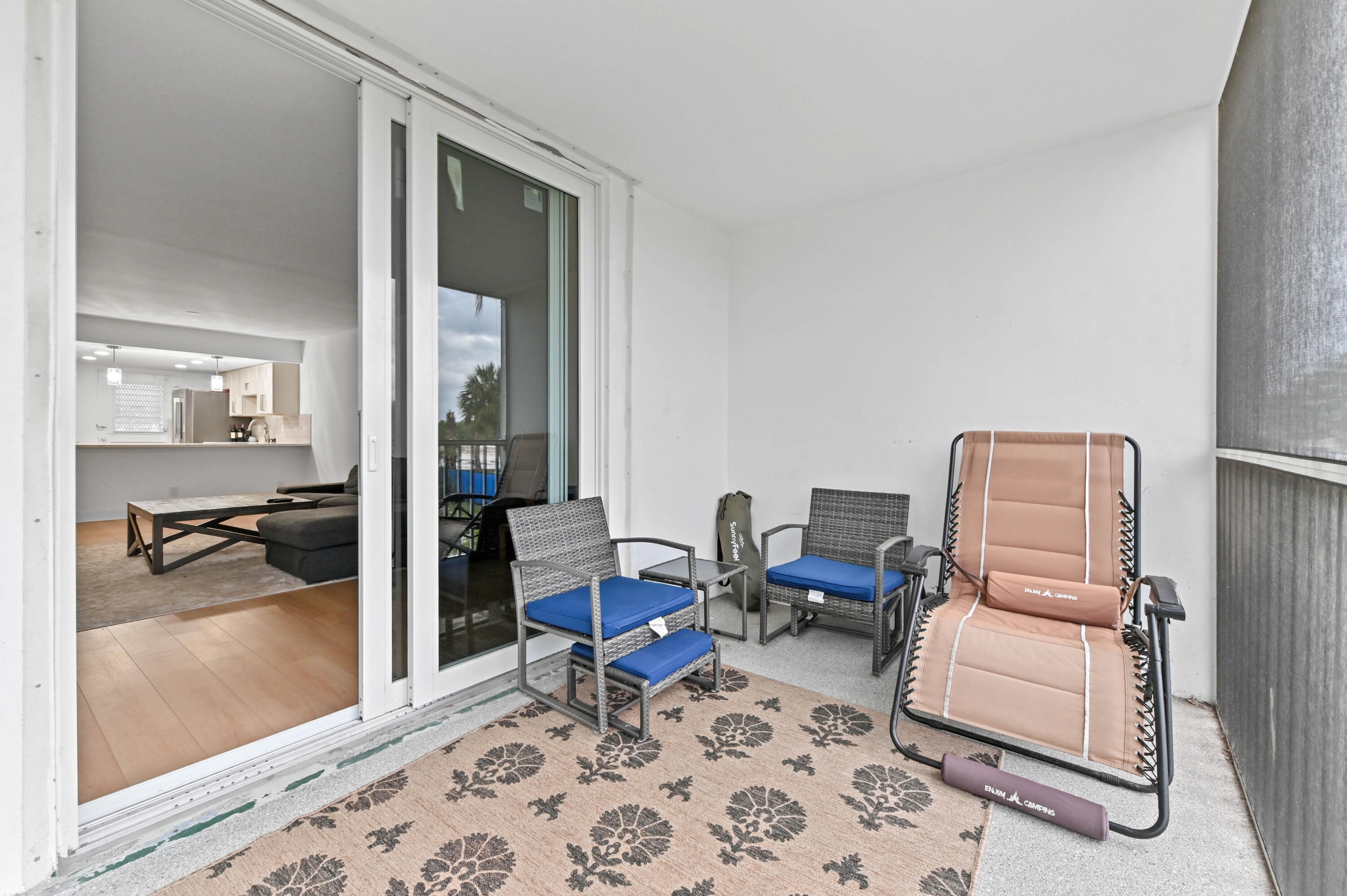 5700 Northwest 2nd Avenue, Unit 211 Boca Raton, FL 33487 - Photo 25 of 29 a living room with furniture and a window