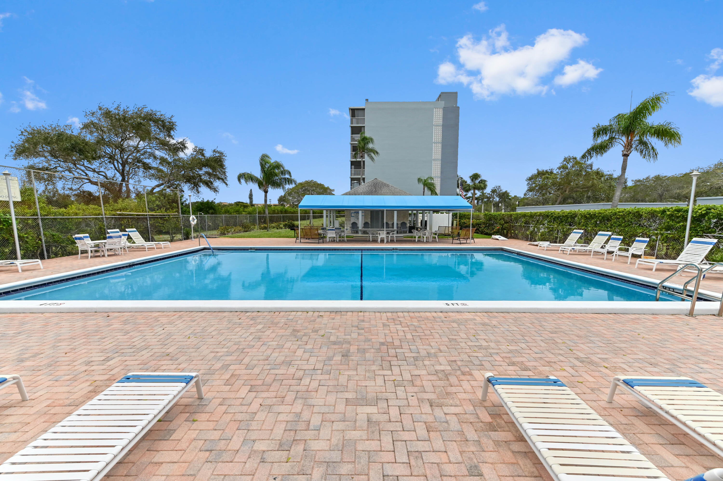 5700 Northwest 2nd Avenue, Unit 211 Boca Raton, FL 33487 - Photo 28 of 29 a view of a swimming pool and lounge chairs