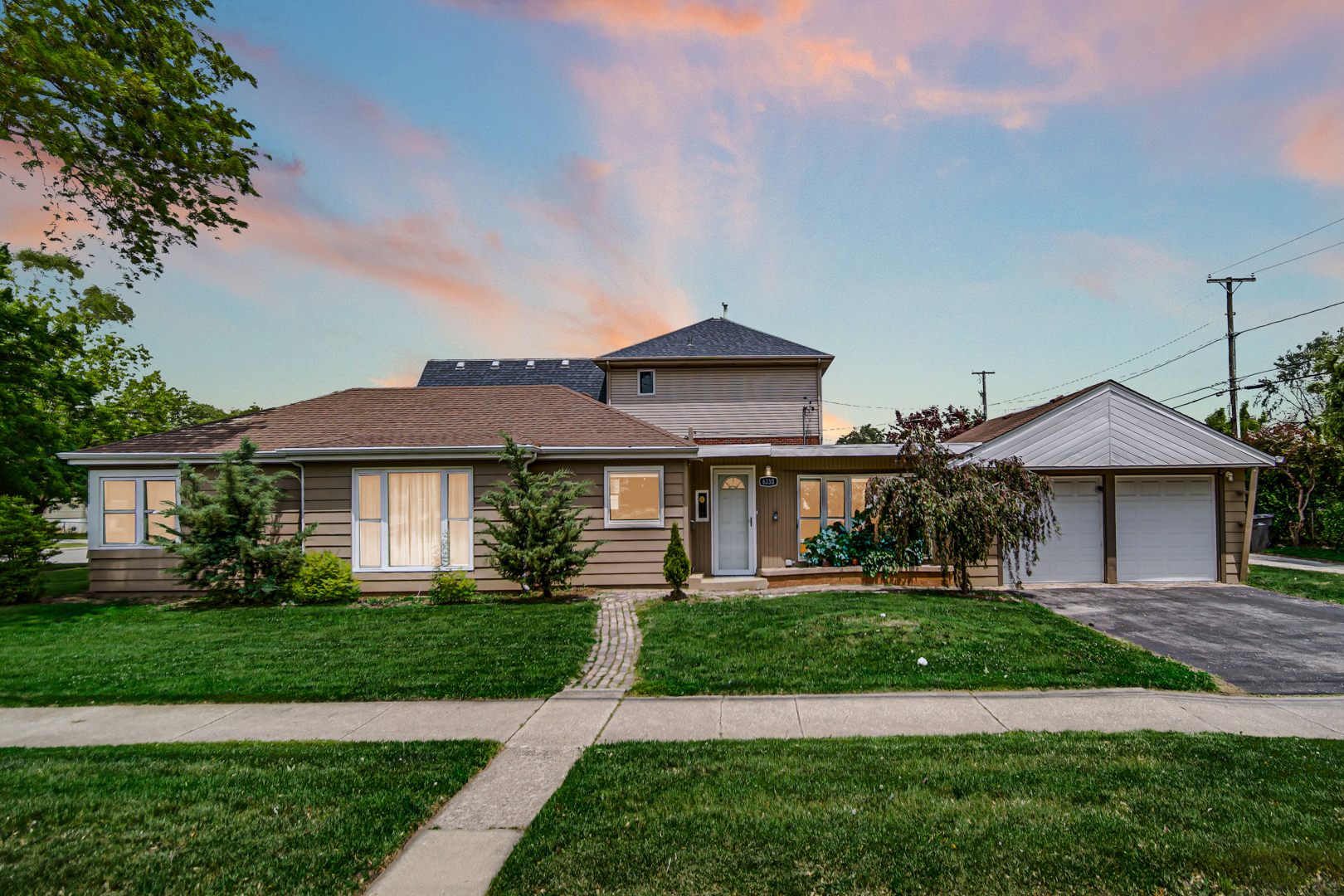6330 107th Street Chicago Ridge, IL 60415 - Photo 1 of 27 a front view of a house with a yard