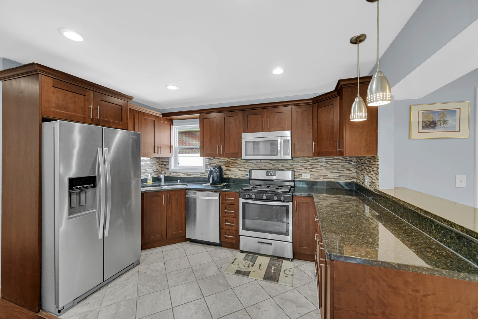 6330 107th Street Chicago Ridge, IL 60415 - Photo 15 of 27 a kitchen with stainless steel appliances granite countertop a refrigerator sink and stove