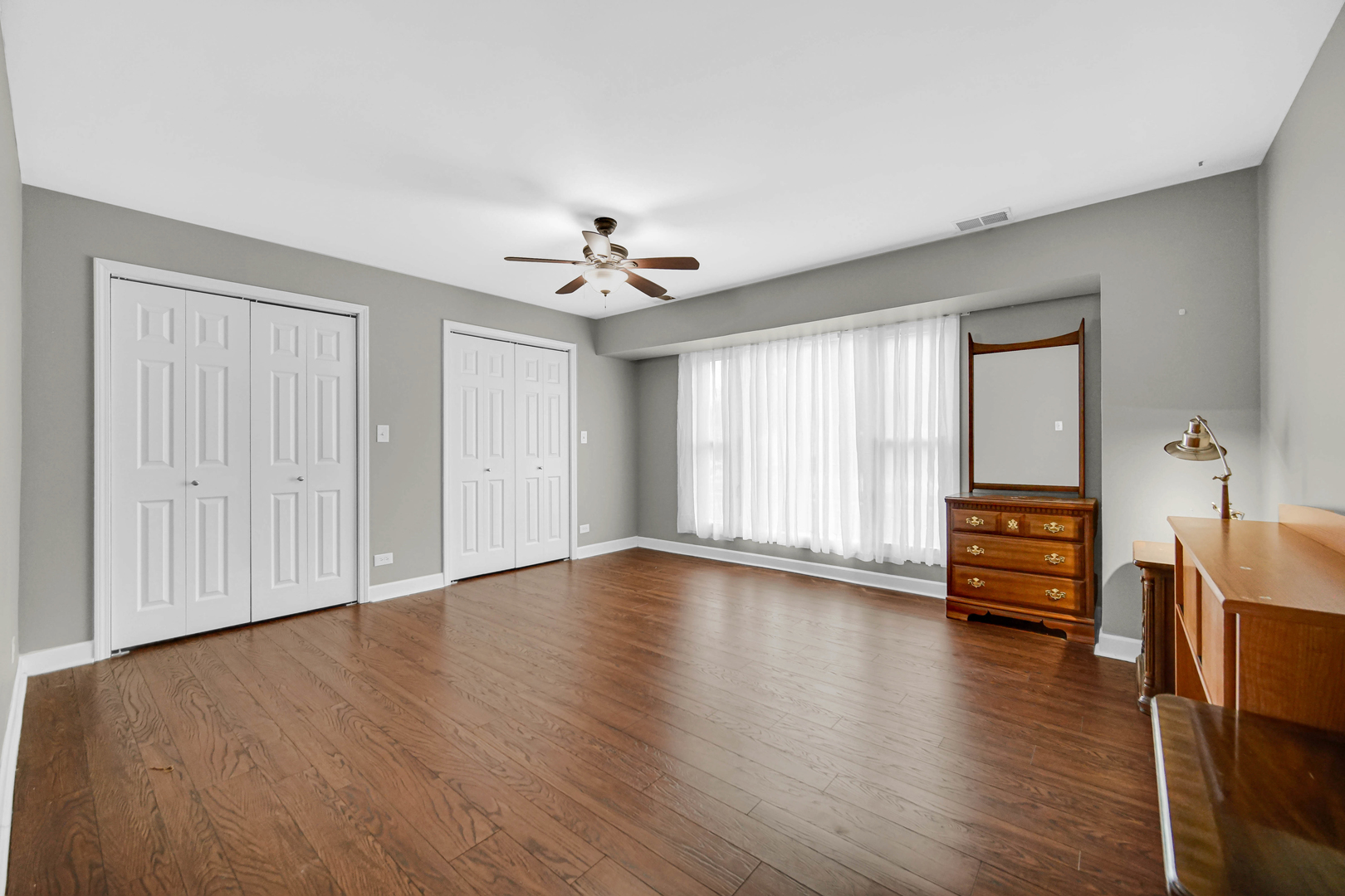 6330 107th Street Chicago Ridge, IL 60415 - Photo 17 of 27 wooden floor in an empty room with a window