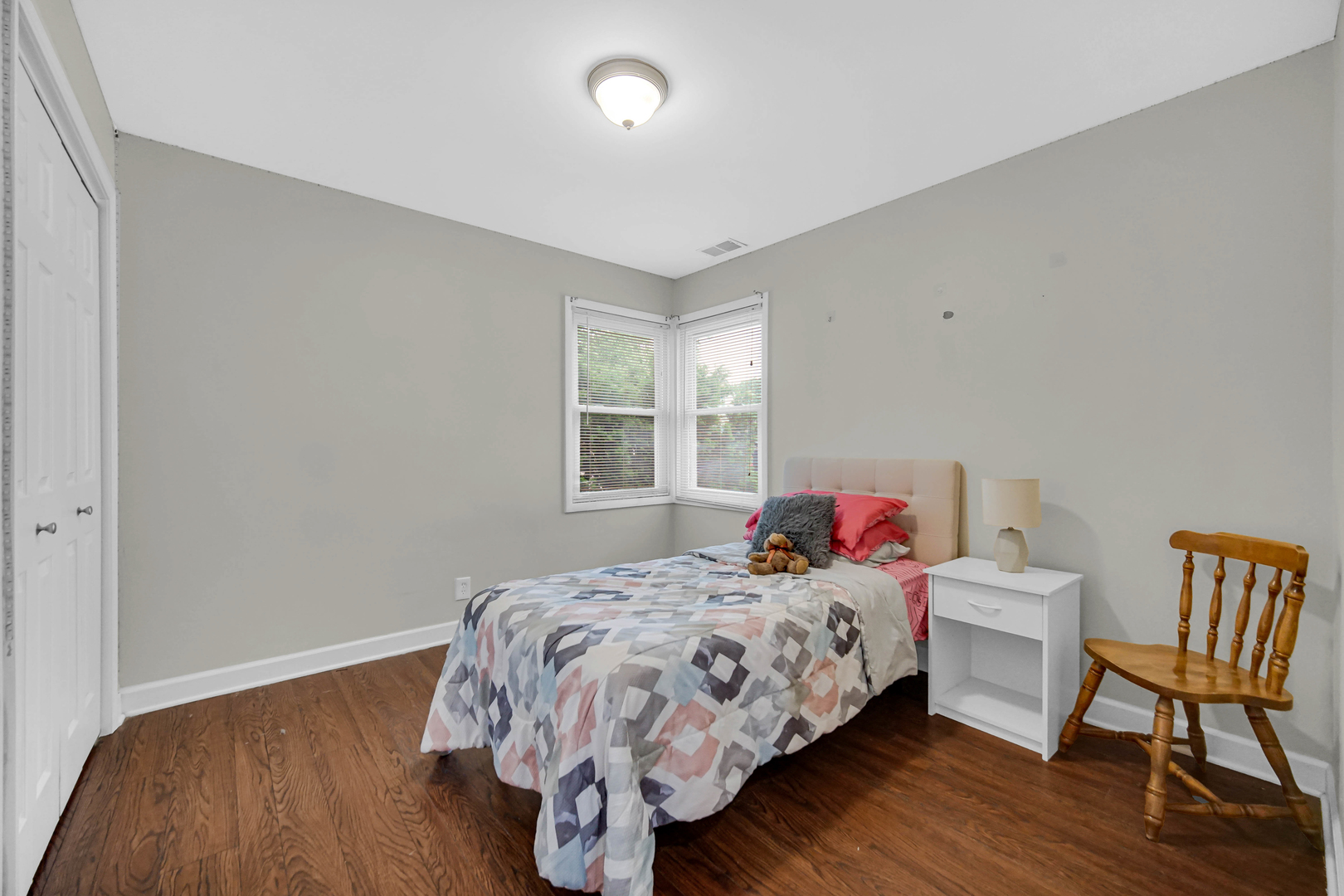6330 107th Street Chicago Ridge, IL 60415 - Photo 19 of 27 a bedroom with a bed and wooden floor