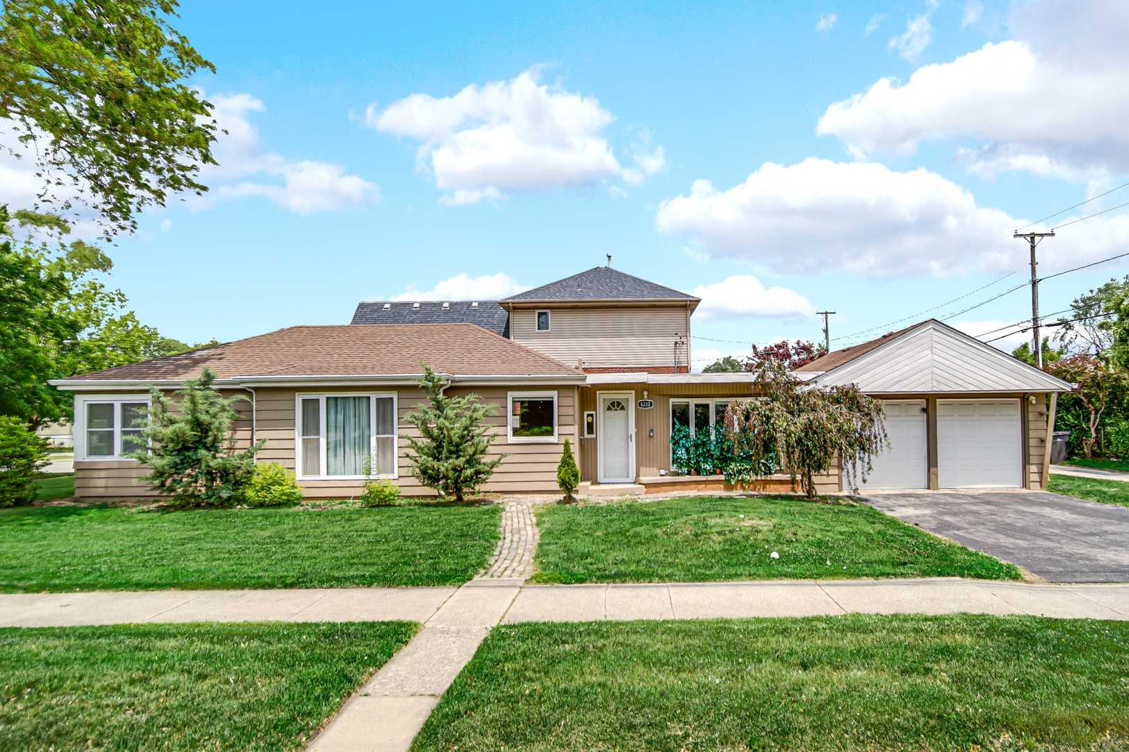 6330 107th Street Chicago Ridge, IL 60415 - Photo 2 of 27 a front view of a house with a yard