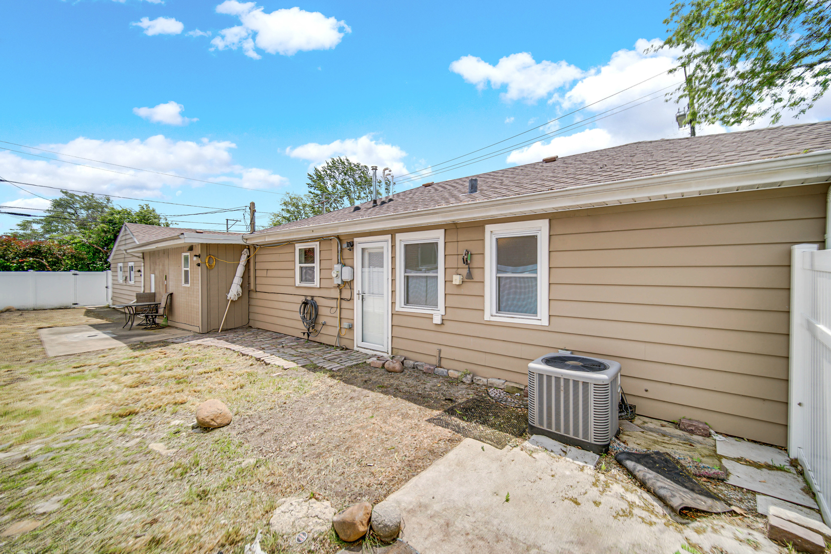 6330 107th Street Chicago Ridge, IL 60415 - Photo 27 of 27 a view of a house with backyard and sitting area