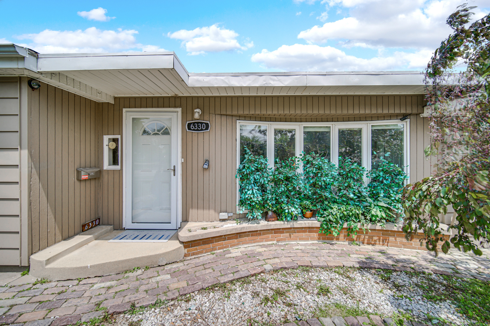 6330 107th Street Chicago Ridge, IL 60415 - Photo 5 of 27 a view of a house with potted plants
