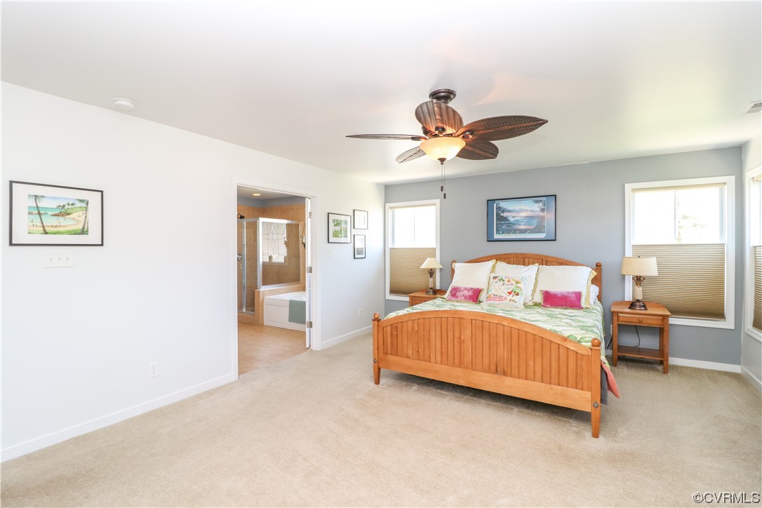 4628 Allenbend Road Glen Allen, VA 23060 - Photo 24 of 50 a bedroom with a bed and a chandelier