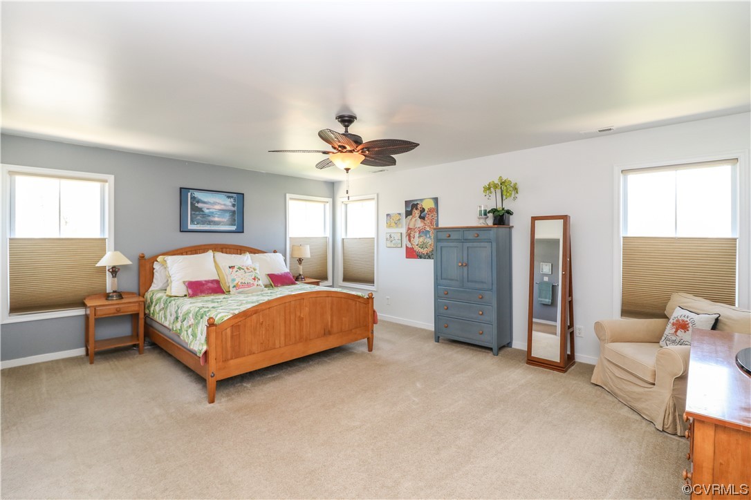 4628 Allenbend Road Glen Allen, VA 23060 - Photo 25 of 50 a bedroom with a bed and a chandelier