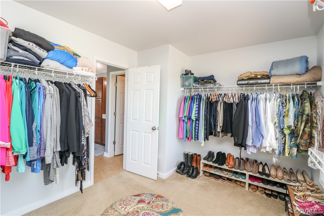 4628 Allenbend Road Glen Allen, VA 23060 - Photo 31 of 50 a view of walk in closet with clothes and shoes