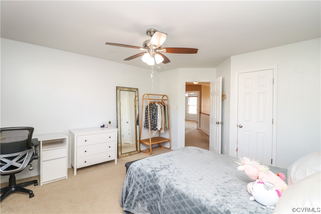 4628 Allenbend Road Glen Allen, VA 23060 - Photo 35 of 50 a bedroom with a bed and a chandelier
