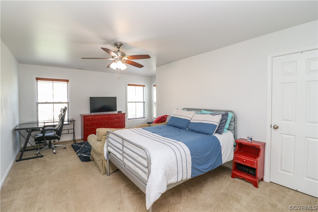 4628 Allenbend Road Glen Allen, VA 23060 - Photo 37 of 50 a bedroom with a bed and a chandelier