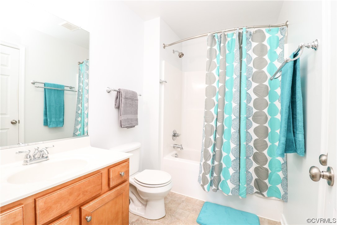 4628 Allenbend Road Glen Allen, VA 23060 - Photo 42 of 50 a bathroom with a sink a toilet and shower curtain