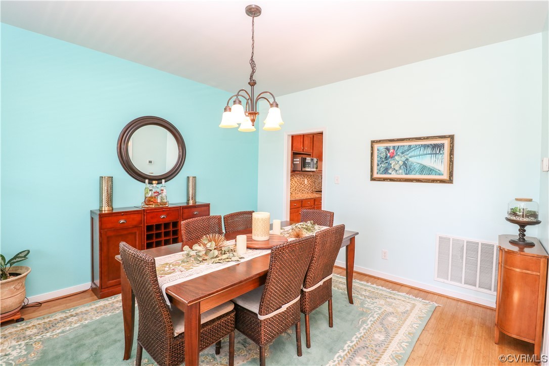4628 Allenbend Road Glen Allen, VA 23060 - Photo 6 of 50 a dining room with a wooden table and chairs