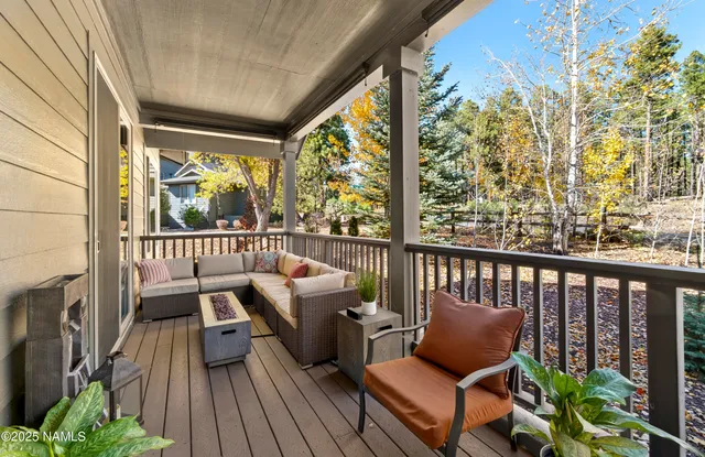 a view of a two chairs in the balcony