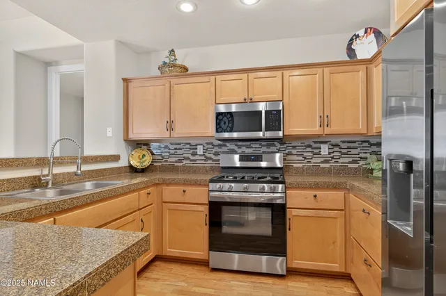 a bathroom with a tub sink shower and mirror