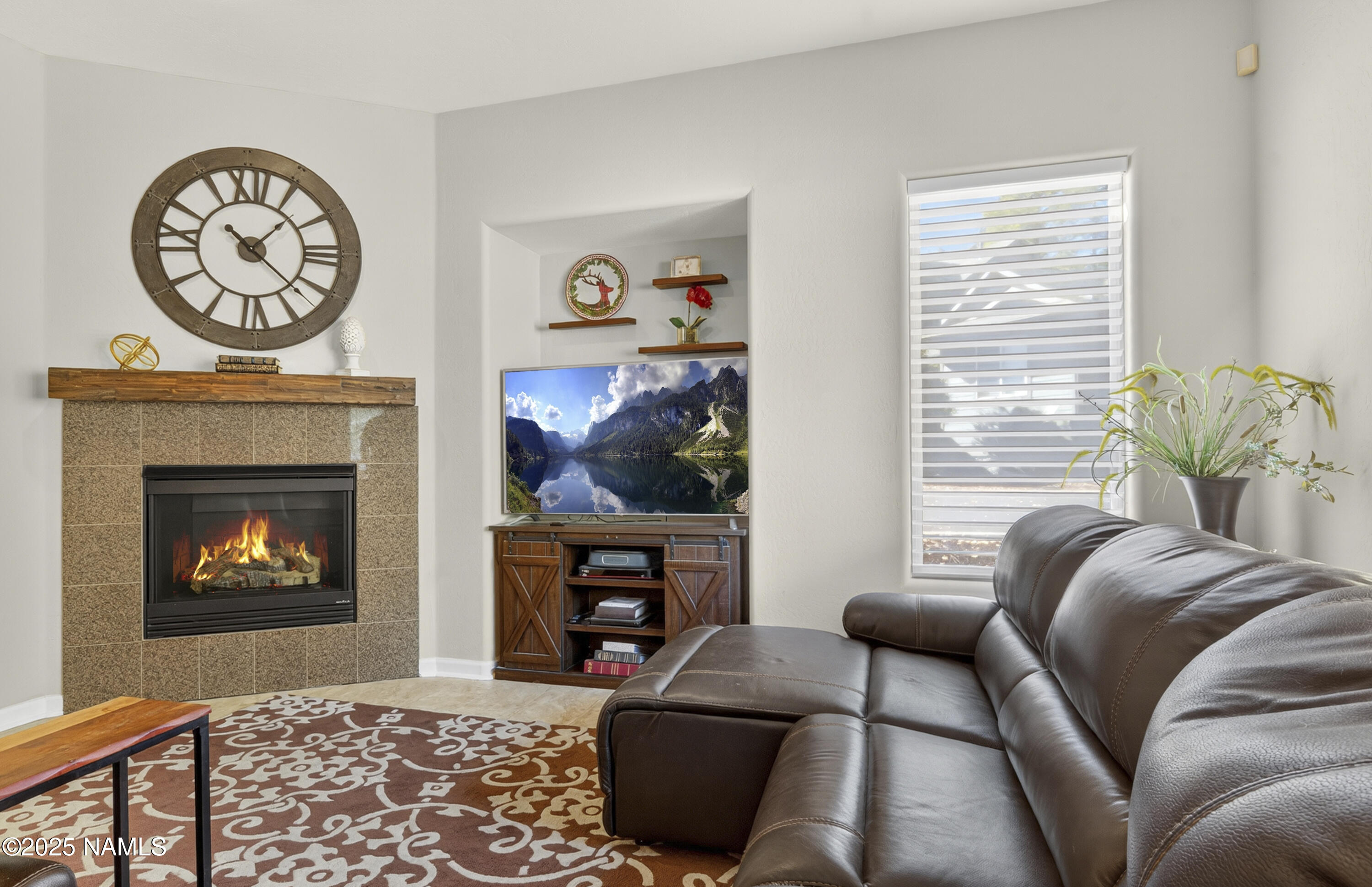 4900 West Quick Draw Flagstaff, AZ 86005 - Photo 12 of 36 a living room with furniture and a fireplace