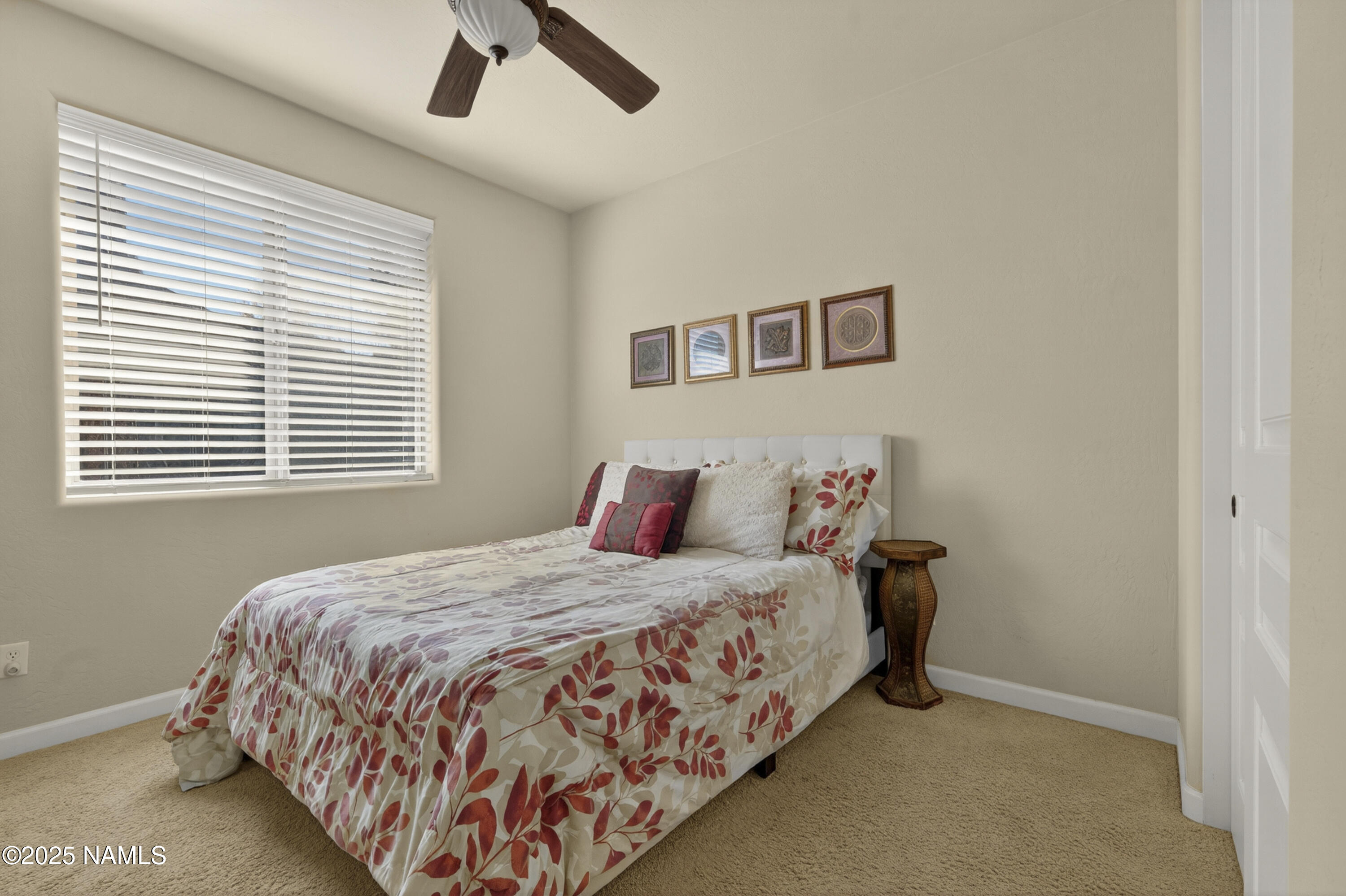 4900 West Quick Draw Flagstaff, AZ 86005 - Photo 15 of 36 a bedroom with a bed and a window