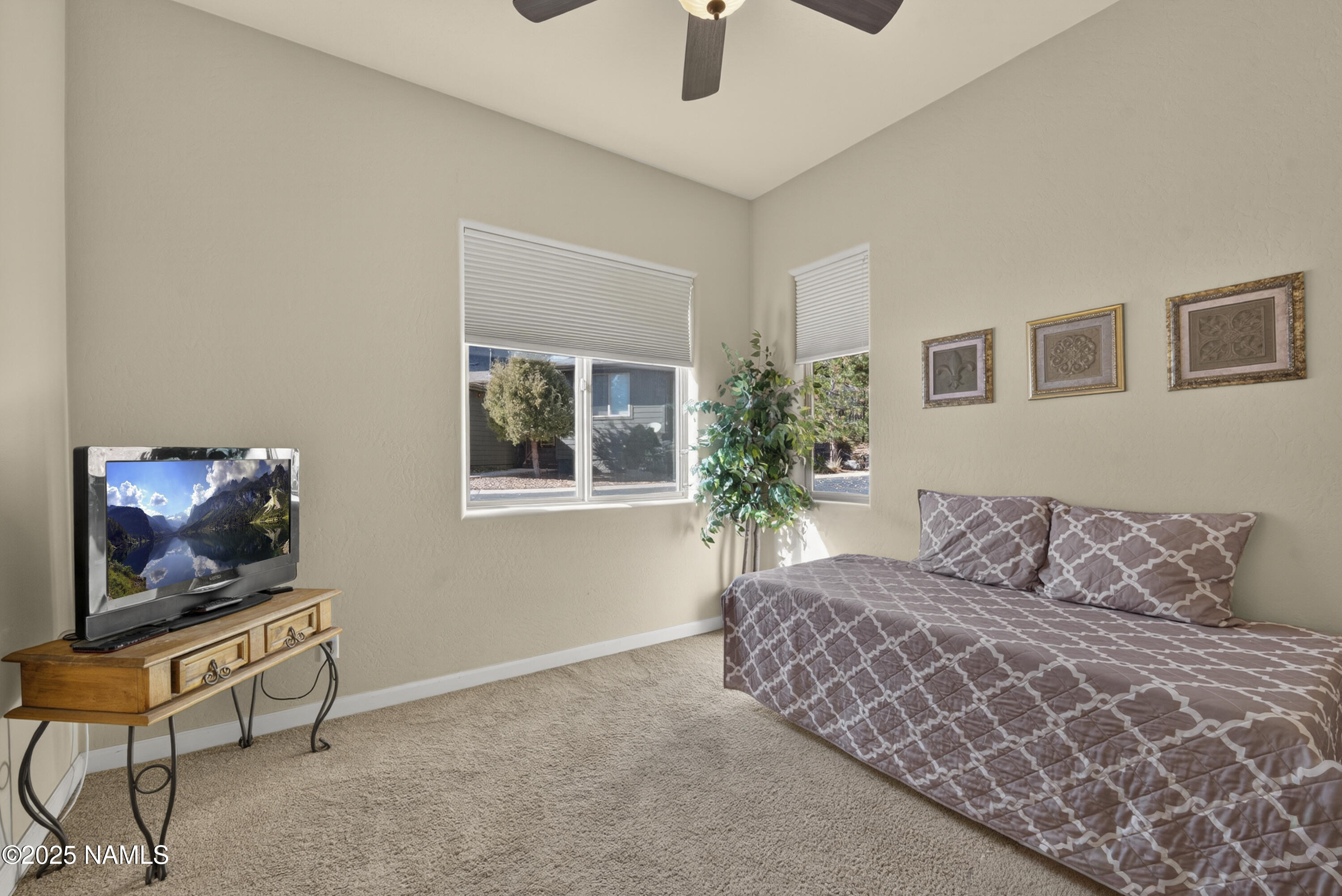 4900 West Quick Draw Flagstaff, AZ 86005 - Photo 18 of 36 a bedroom with a bed and a window