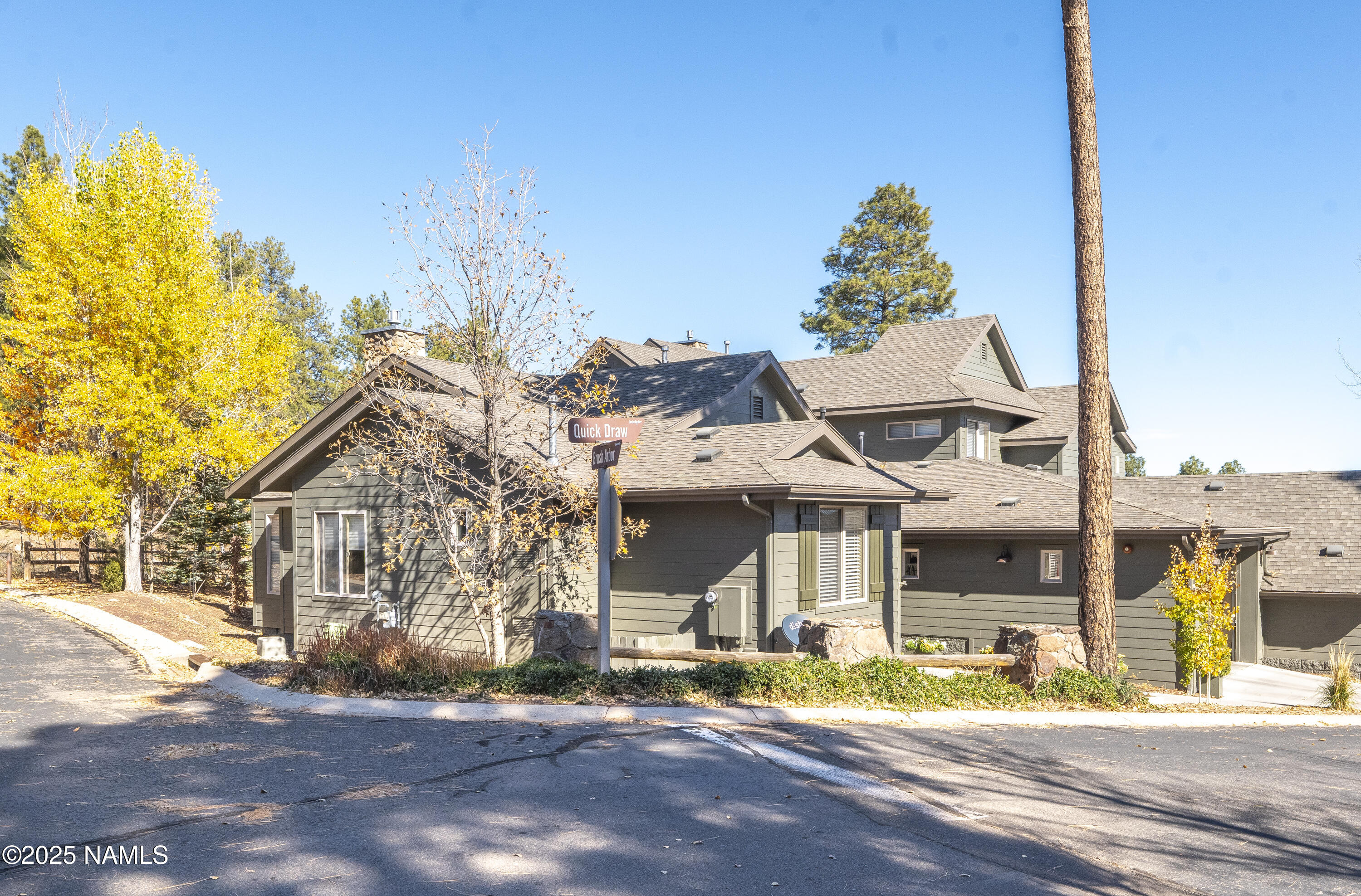 4900 West Quick Draw Flagstaff, AZ 86005 - Photo 30 of 36 front view of a building with a garden