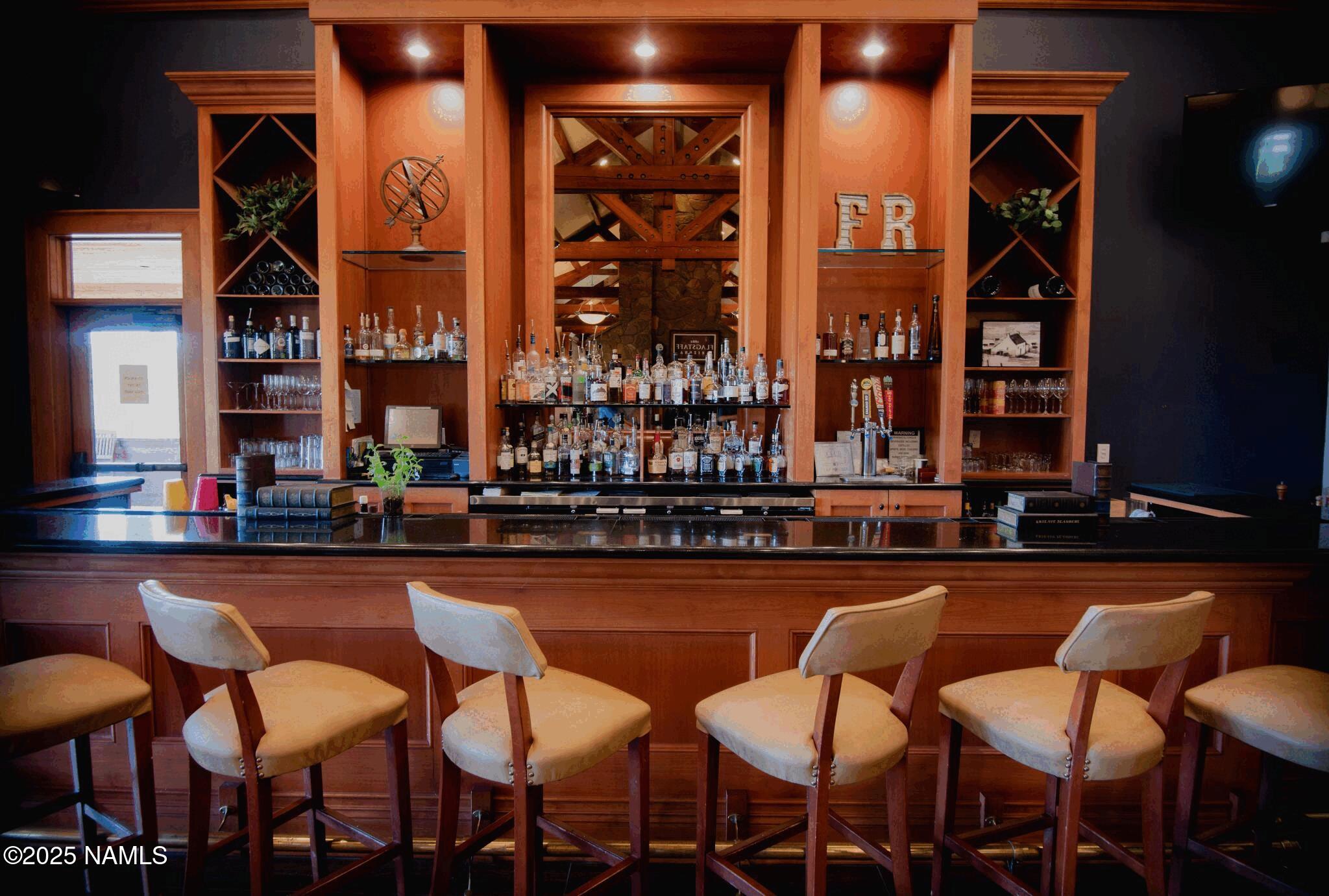 4900 West Quick Draw Flagstaff, AZ 86005 - Photo 32 of 36 a view of a chairs and table in a patio