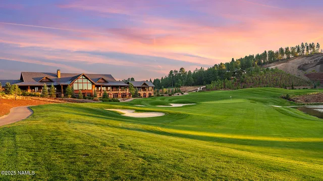 a view of an house with a big yard