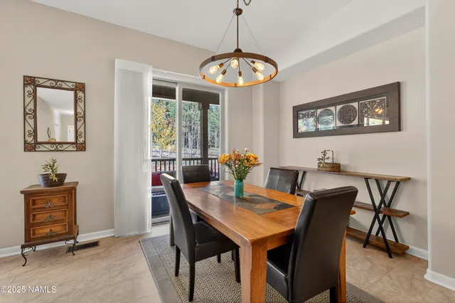 a living room with furniture a window and a fireplace