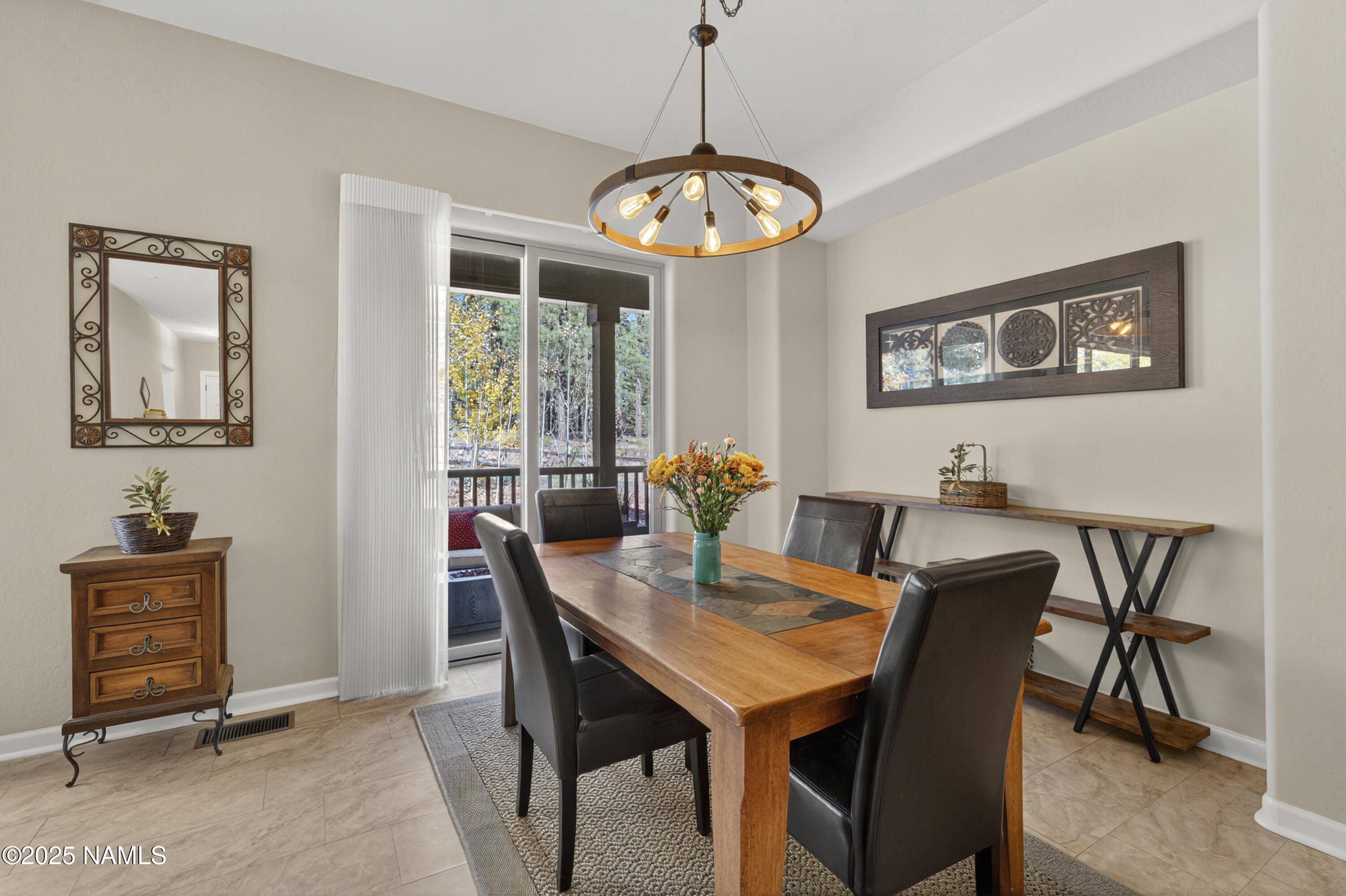 4900 West Quick Draw Flagstaff, AZ 86005 - Photo 6 of 36 a view of a dining room with furniture window and wooden floor