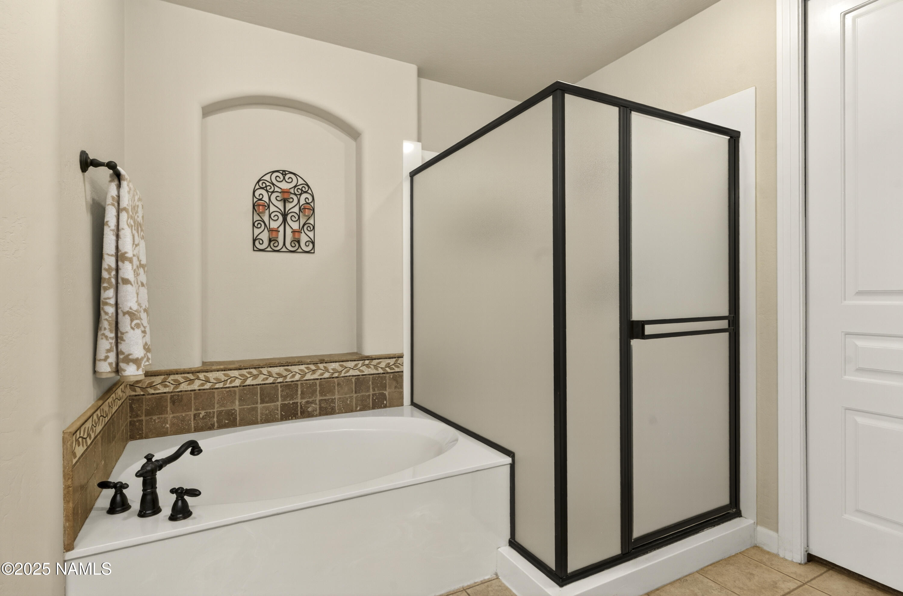 4900 West Quick Draw Flagstaff, AZ 86005 - Photo 8 of 36 a bathroom with a bathtub and a shower